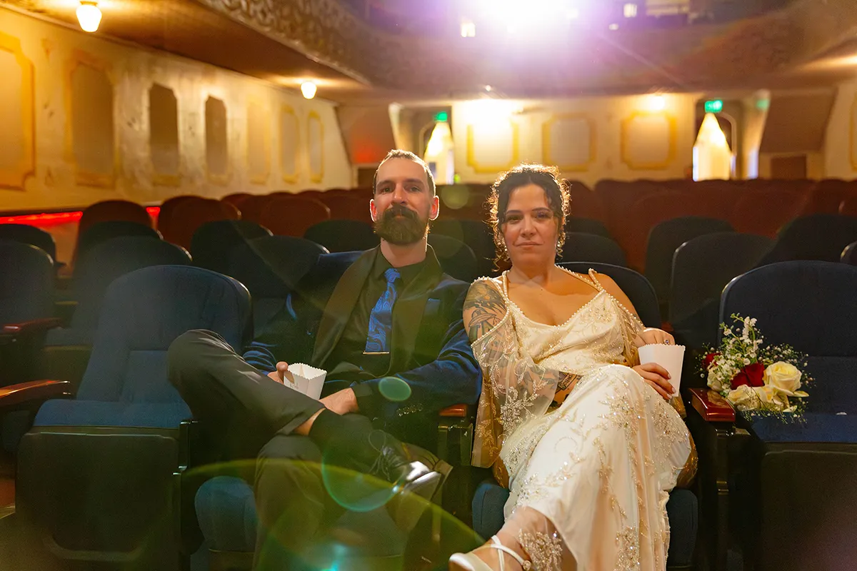 Couple seated inside Ruby Theatre during Chelan wedding