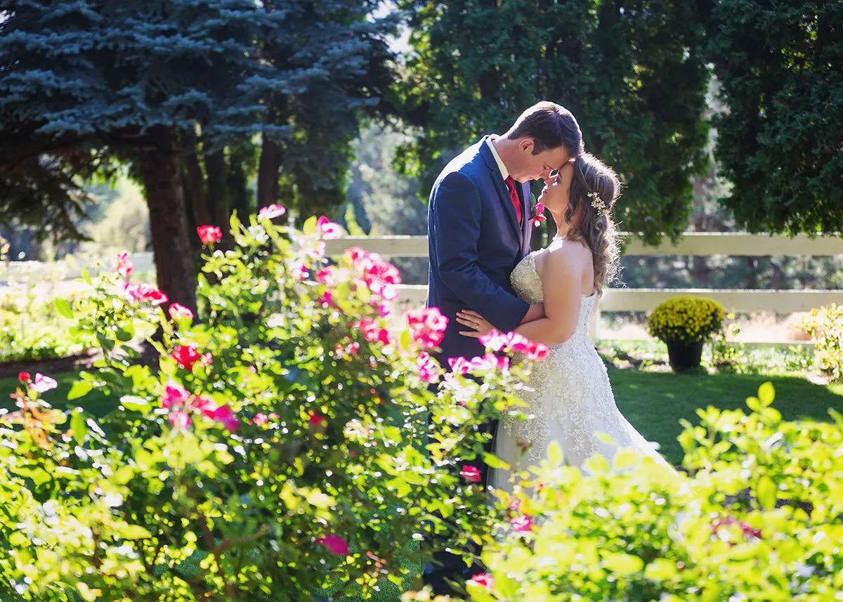 Bride and groom at Wenatchee farmhouse wedding in an intimate embrace
